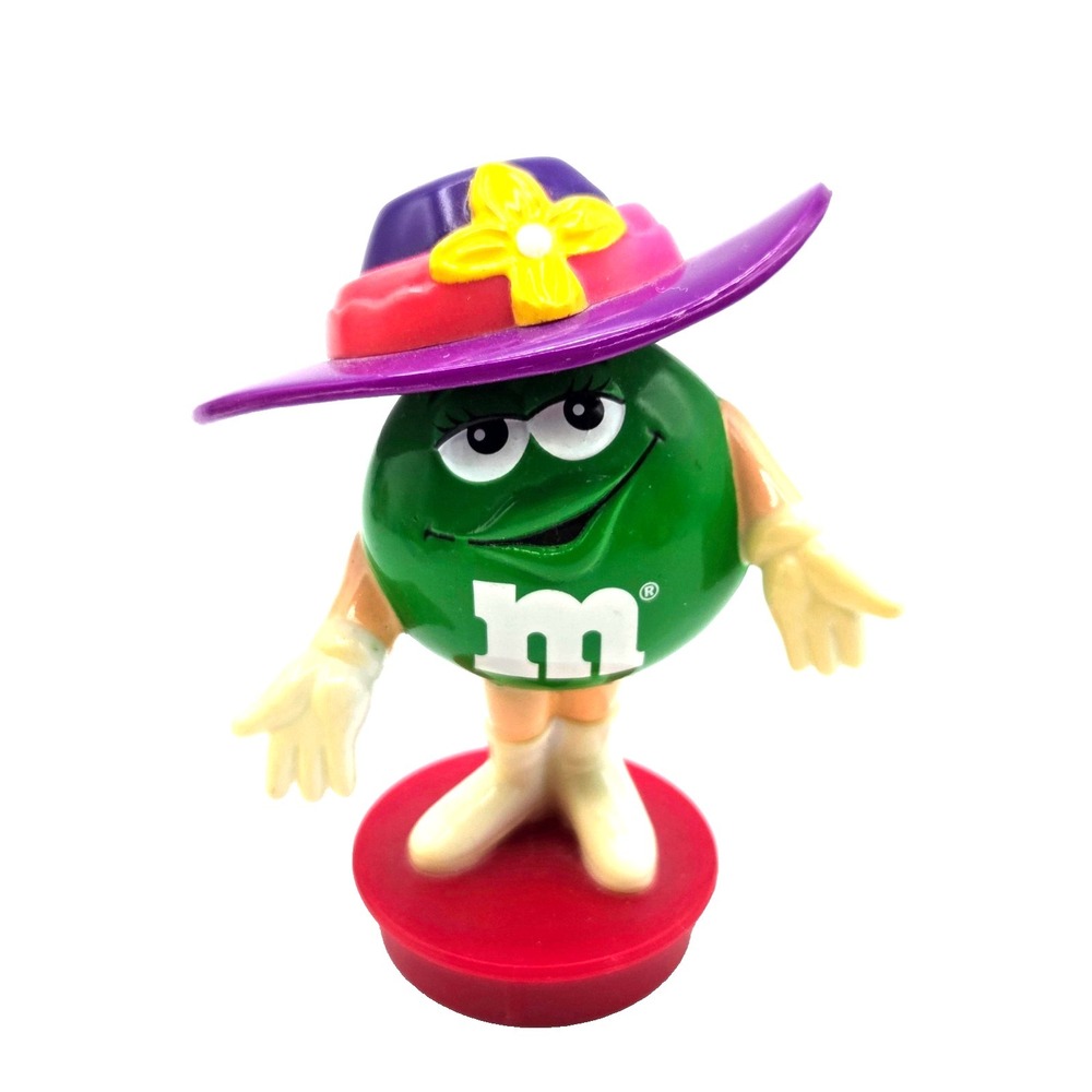 Green M&M Wearing a Purple Hat Tube Topper‎